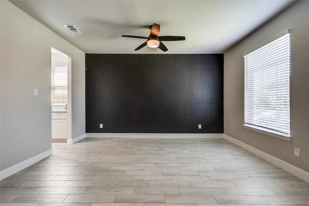 2912 Inn Kitchen Way McKinney, TX 75071 - Photo 9 of 29 a view of an empty room with wooden floor and a window