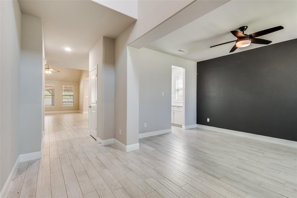 2912 Inn Kitchen Way McKinney, TX 75071 - Photo 10 of 29 a view of an empty room and wooden floor