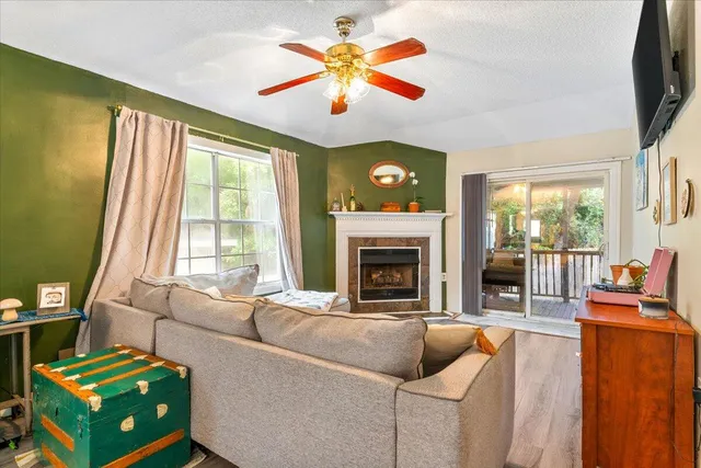 a living room with furniture and a fireplace