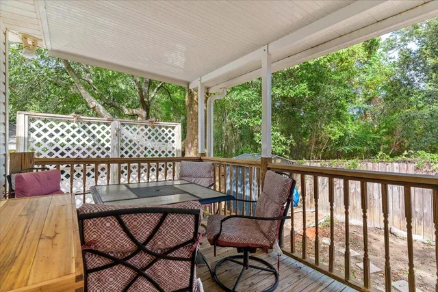 a view of a chairs and table in the balcony