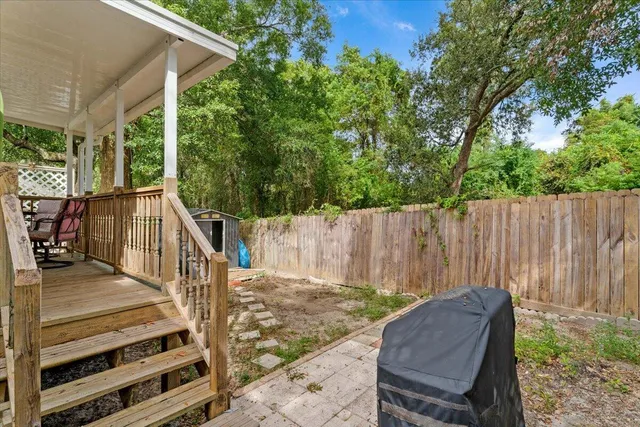 a balcony with view of trees in the background