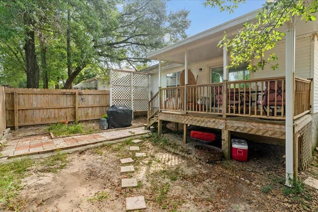 a backyard of a house with oven and garden