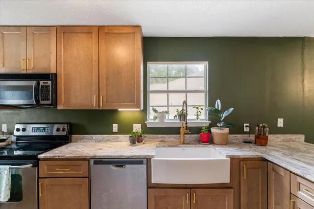 a kitchen with a sink and cabinets