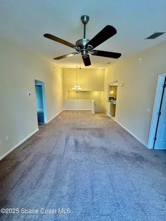 a view of a room with a flat screen tv