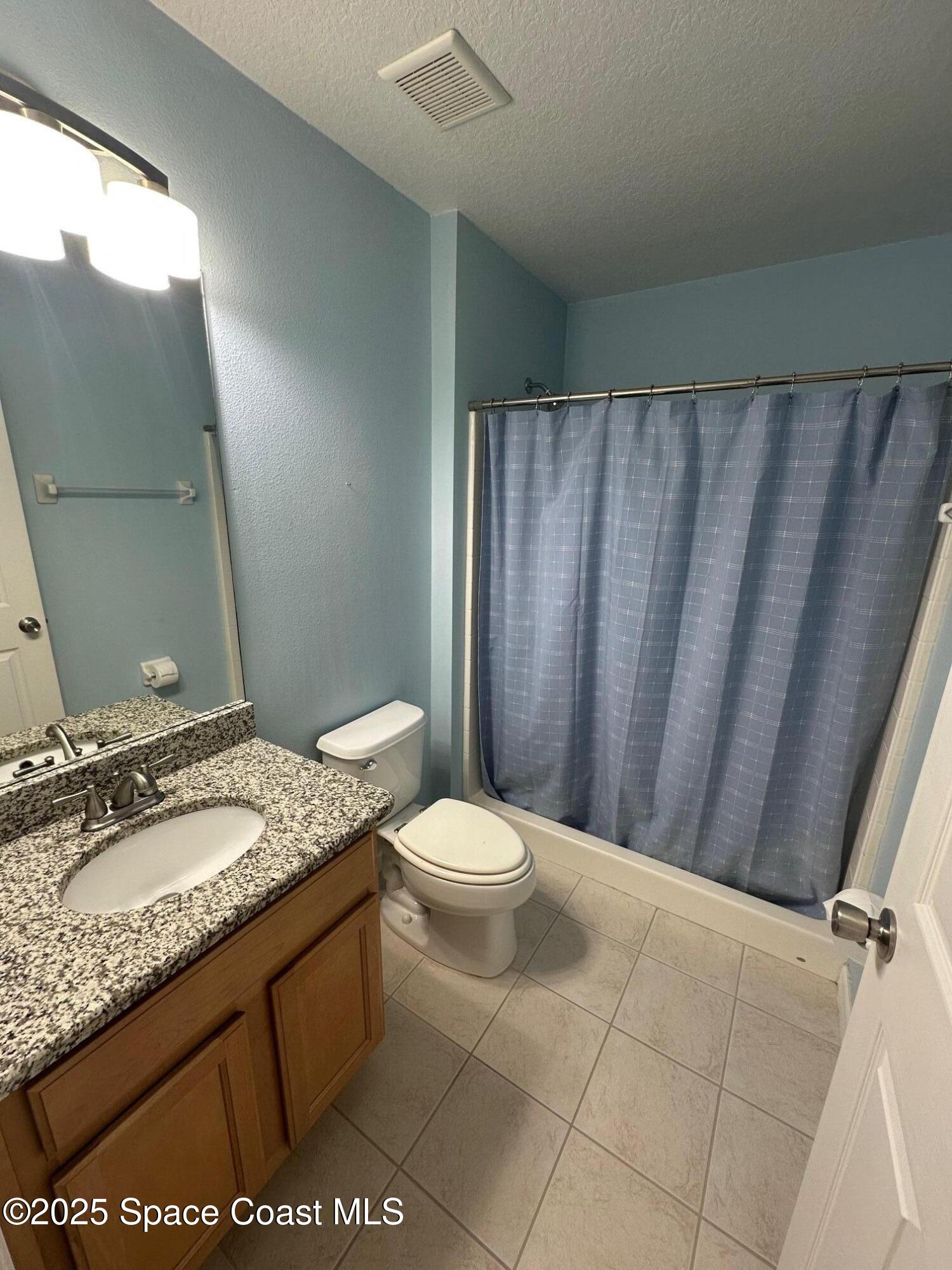 4106 Meander Place, Unit 208 Rockledge, FL 32955 - Photo 7 of 19 a bathroom with a granite countertop sink toilet and shower