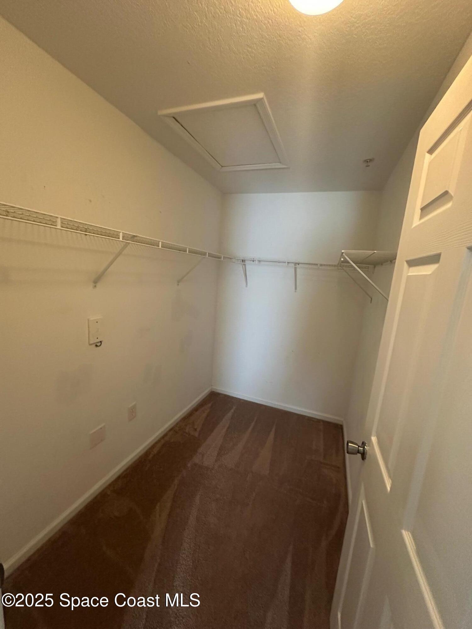 4106 Meander Place, Unit 208 Rockledge, FL 32955 - Photo 9 of 19 a view of a room with racks on the wall