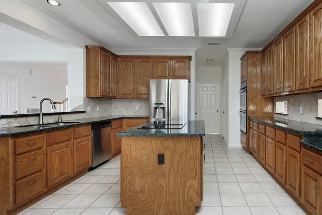 a kitchen with sink cabinets and window