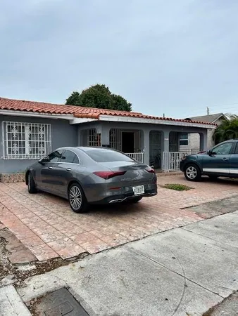 a car parked in front of a house