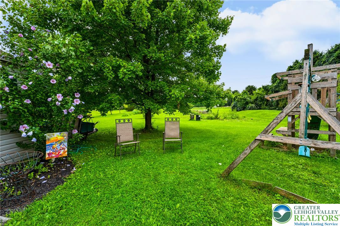 6970 Silver Crest Road Nazareth, PA 18064 - Photo 34 of 35 A spacious, verdant yard with mature trees offers ample room for outdoor recreation and relaxation.