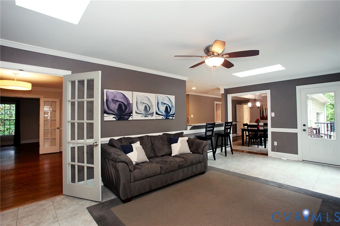 231 Hazelmere Drive Chesterfield, VA 23236 - Photo 10 of 33 a living room with furniture a ceiling fan and a window