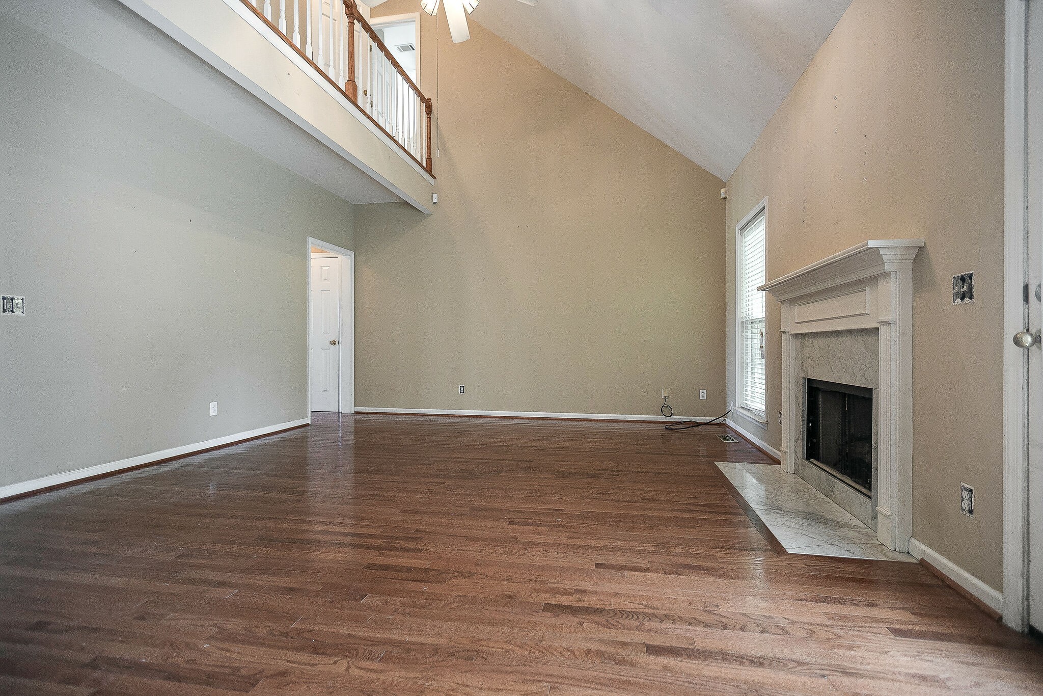 307 Eastside Road Burns, TN 37029 - Photo 12 of 53 a view of empty room with wooden floor and fireplace