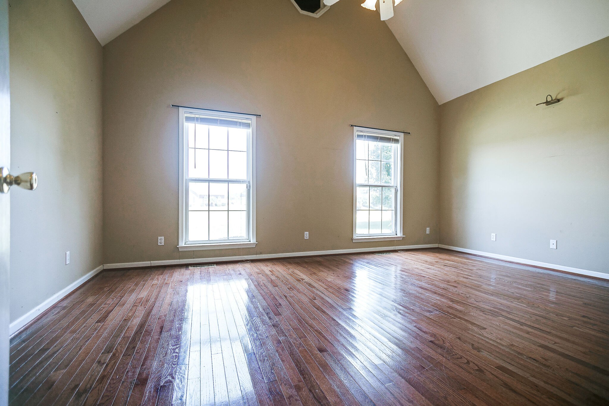 307 Eastside Road Burns, TN 37029 - Photo 16 of 53 a view of an empty room with wooden floor and a window