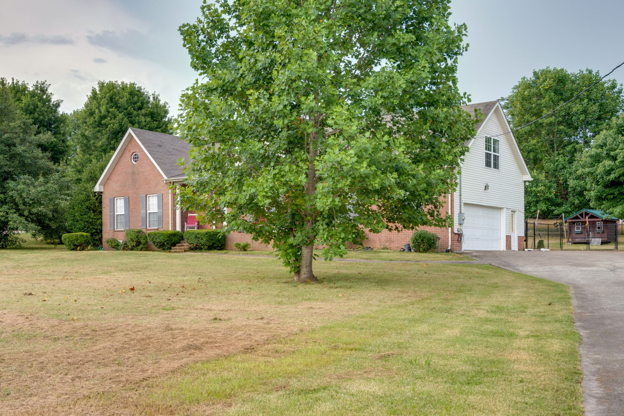 307 Eastside Road Burns, TN 37029 - Photo 3 of 53 a front view of a house with a yard