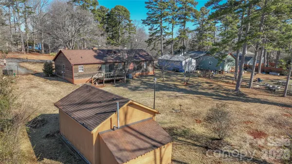 a view of a backyard with sitting area