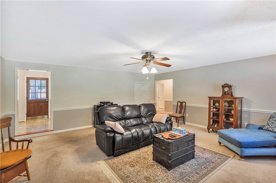 910 Chantilly Lane Anderson, SC 29625 - Photo 27 of 38 A comfortable living space featuring a ceiling fan and natural light.