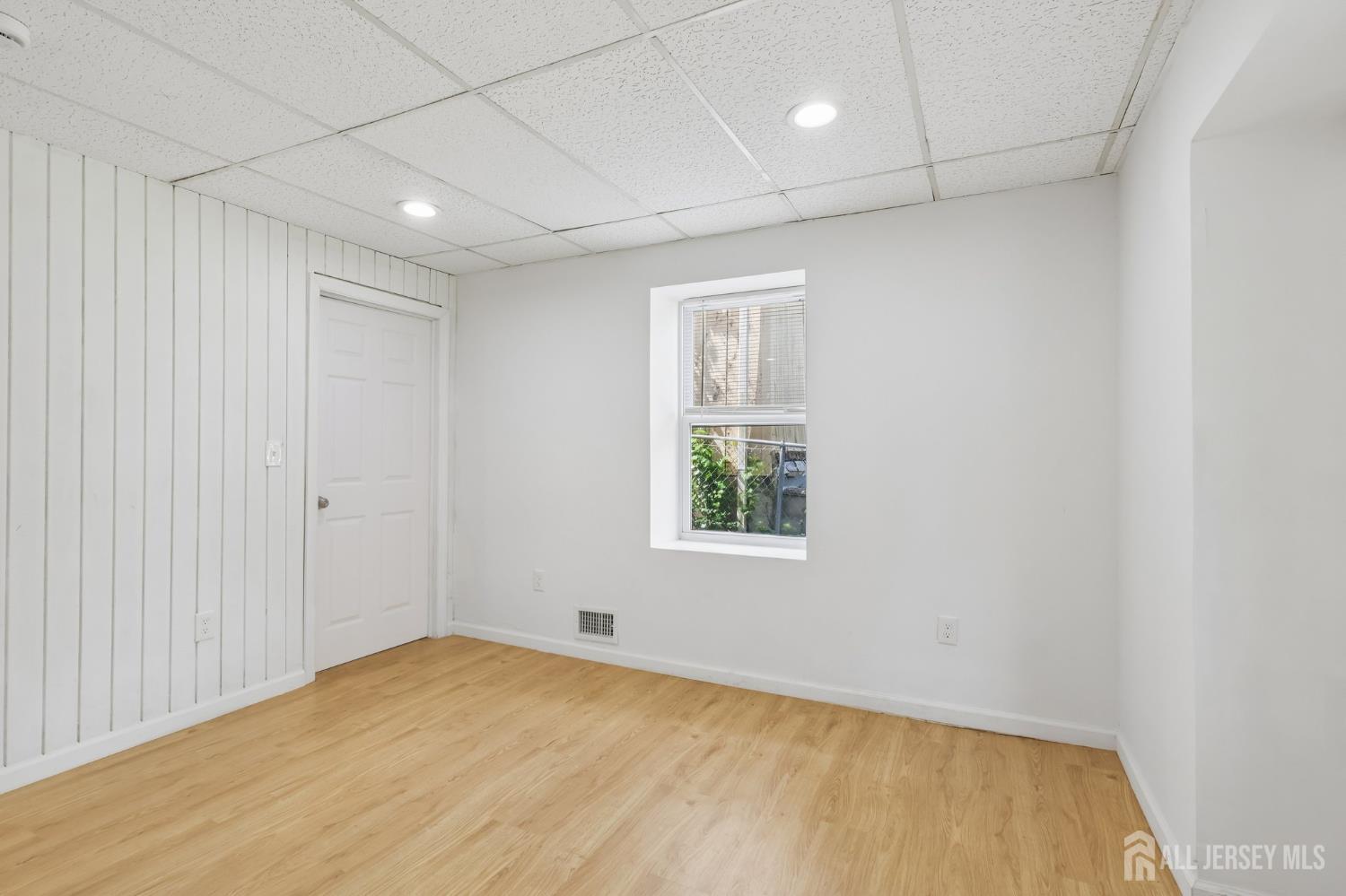 36 Henry Street Edison, NJ 08820 - Photo 21 of 42 an empty room with a empty space and windows
