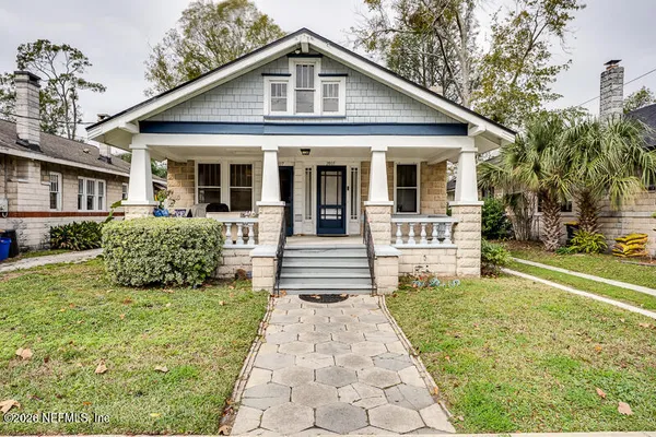 a front view of a house with garden