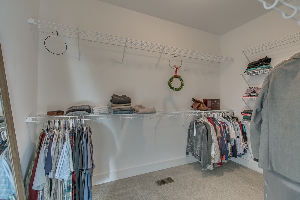 9630 Mona Road Murfreesboro, TN 37129 - Photo 16 of 39 a view of walk in closet with clothes and shoes