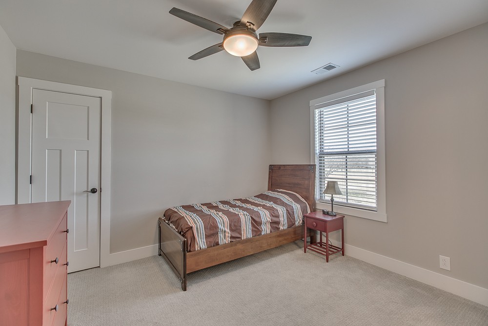 9630 Mona Road Murfreesboro, TN 37129 - Photo 23 of 39 a spacious bedroom with a bed and a chandelier