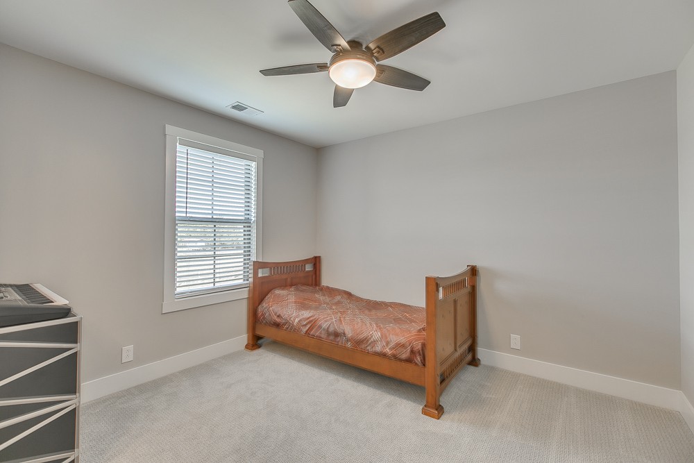 9630 Mona Road Murfreesboro, TN 37129 - Photo 24 of 39 a living room with a bed furniture and a window