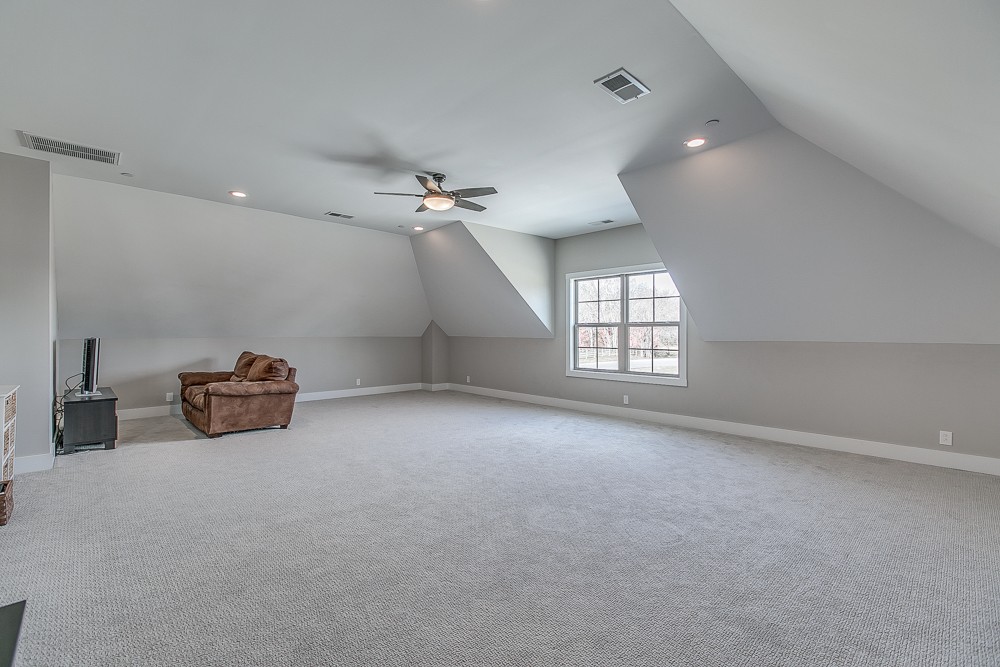 9630 Mona Road Murfreesboro, TN 37129 - Photo 27 of 39 an empty room with windows and ceiling fan