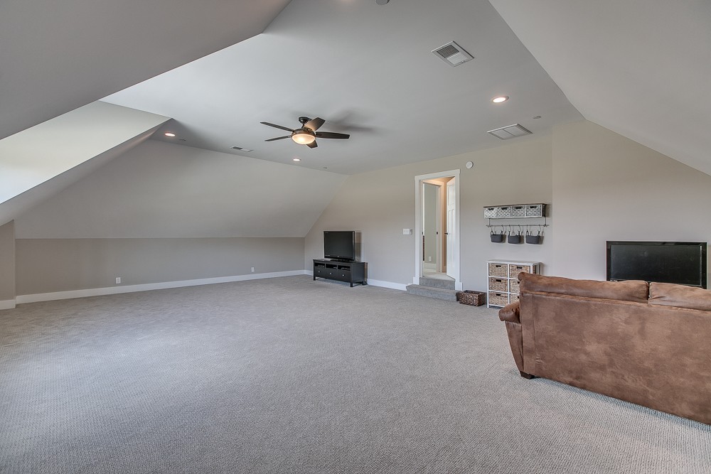 9630 Mona Road Murfreesboro, TN 37129 - Photo 28 of 39 a living room with furniture and a flat screen tv