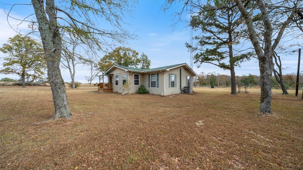 460 VZ County Road Canton, TX 75103 - Photo 3 of 24 a view of house with yard and trees
