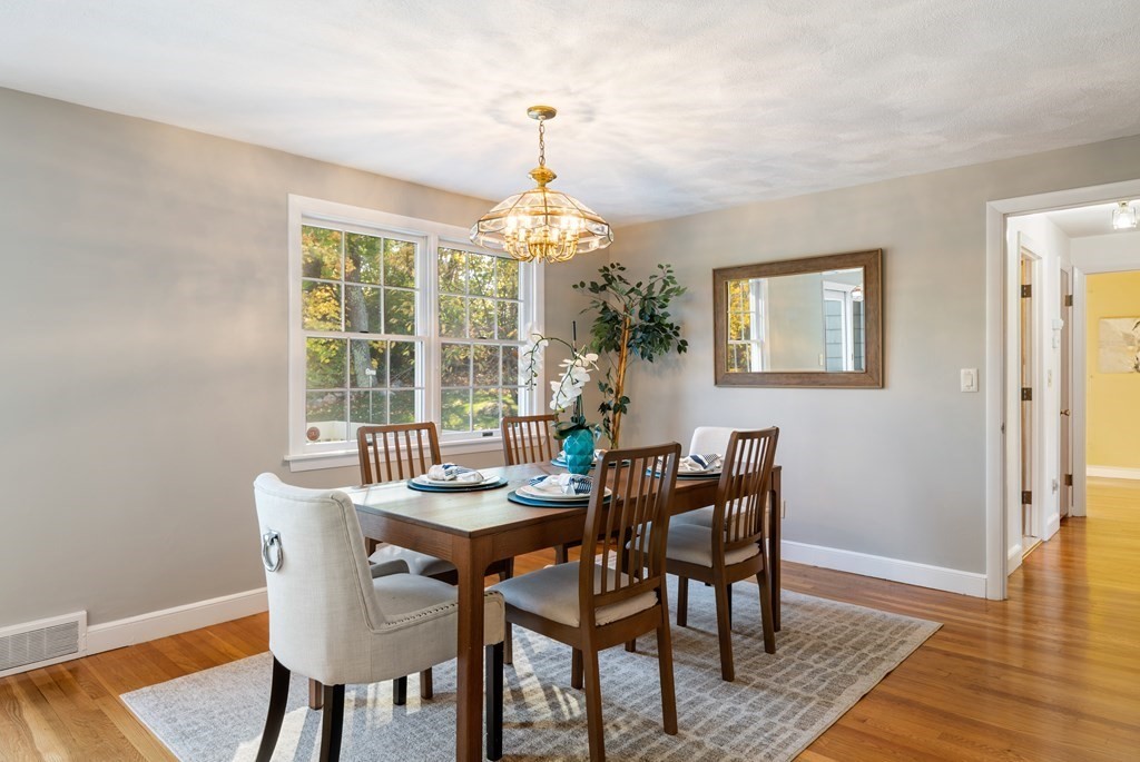 16 Westwood Road Lexington, MA 02420 - Photo 11 of 41 a dining room with furniture a chandelier and wooden floor