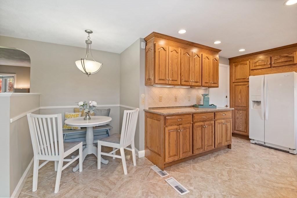 16 Westwood Road Lexington, MA 02420 - Photo 15 of 41 a kitchen with cabinets and chairs