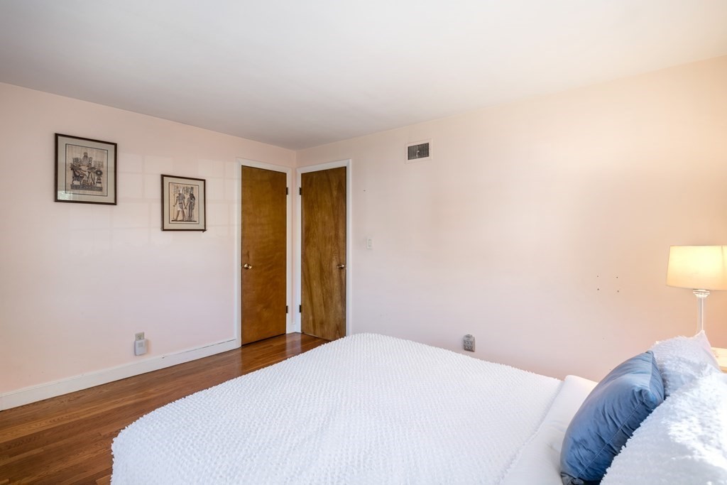 16 Westwood Road Lexington, MA 02420 - Photo 21 of 41 a bedroom with a bed and a wall painting
