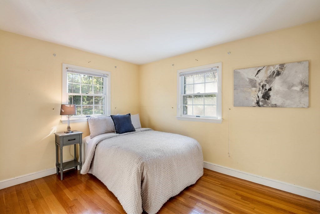 16 Westwood Road Lexington, MA 02420 - Photo 22 of 41 a bedroom with a bed and wooden floor