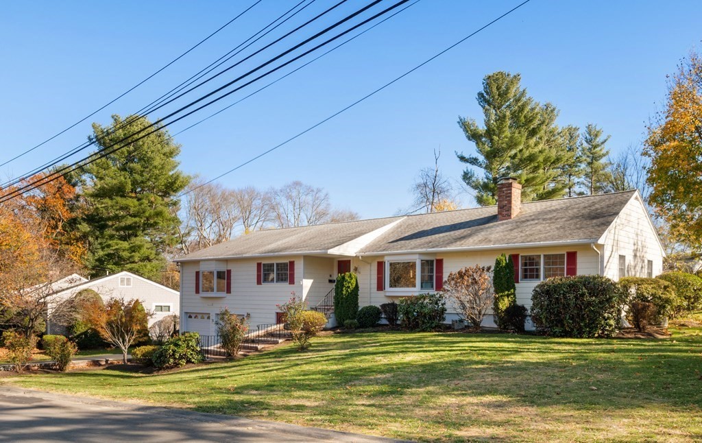 16 Westwood Road Lexington, MA 02420 - Photo 5 of 41 a front view of a house with a garden