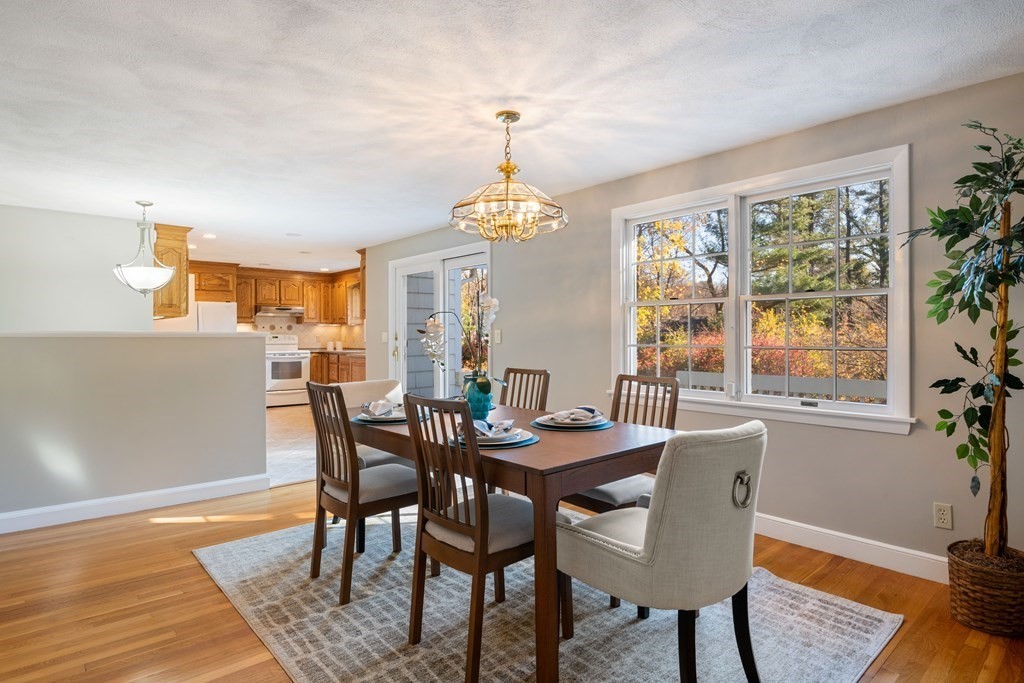 16 Westwood Road Lexington, MA 02420 - Photo 10 of 41 a dining room with furniture a chandelier and wooden floor