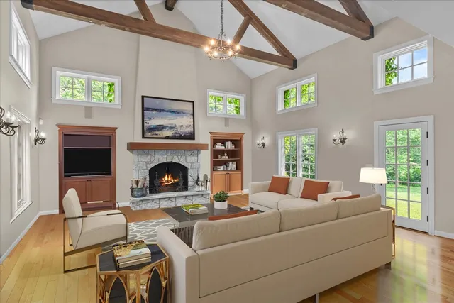 a living room with furniture and a fireplace