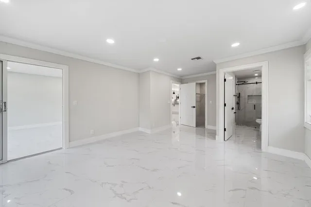 a bathroom with a sink a toilet and a shower