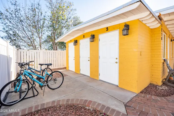 a front view of a house with table and chairs