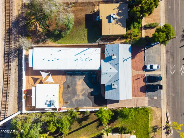 an aerial view of a house with a yard