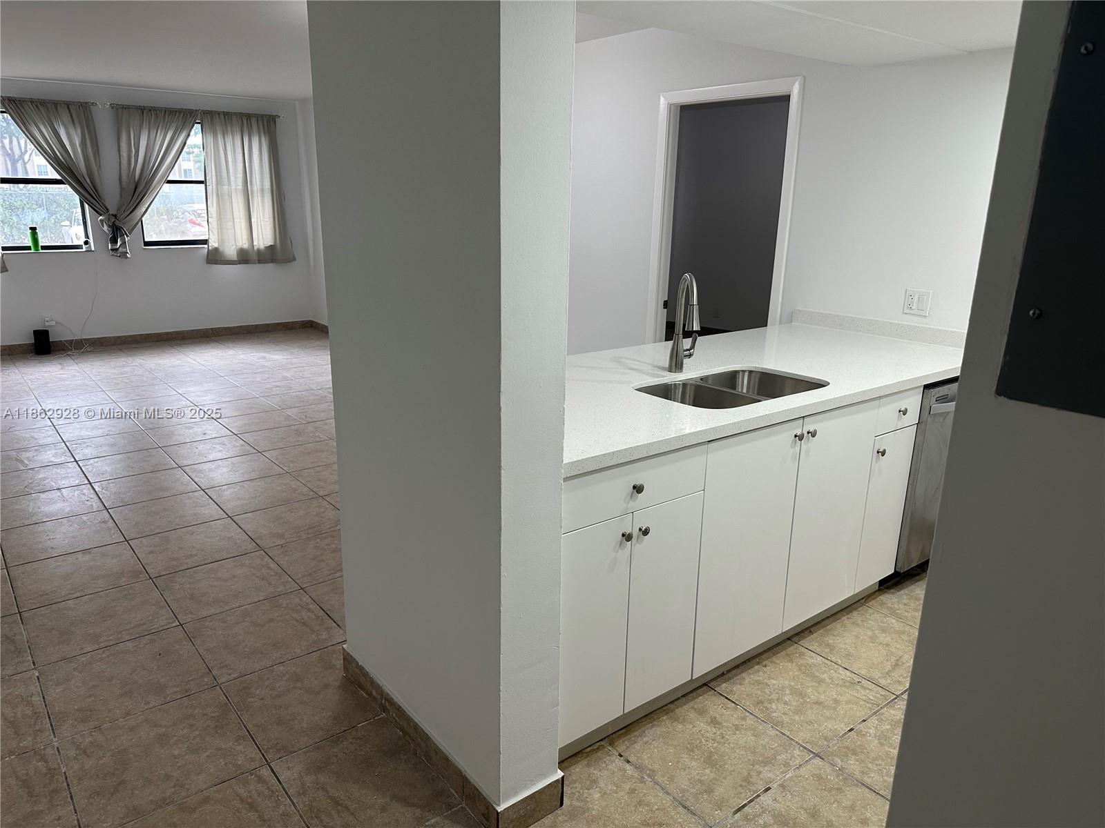 8100 Geneva Court, Unit 142 Doral, FL 33166 - Photo 5 of 11 a view of a bathroom with a sink and mirror