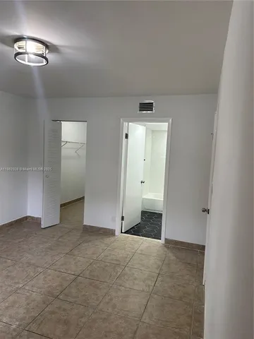 an empty room with a bathroom