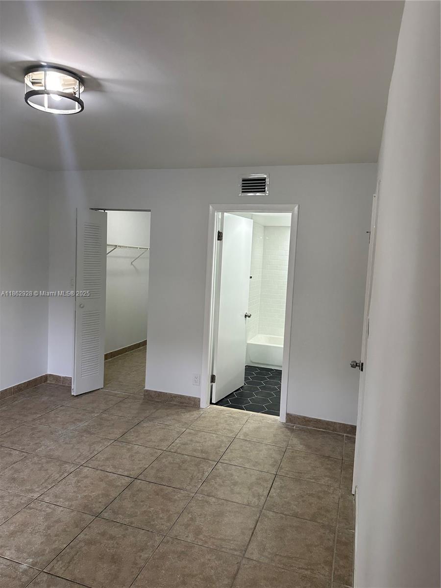 8100 Geneva Court, Unit 142 Doral, FL 33166 - Photo 8 of 11 a view of an empty room