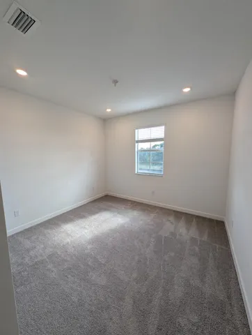 a view of an empty room and window