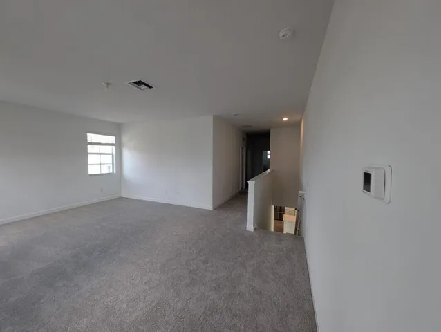 an empty room that has a window