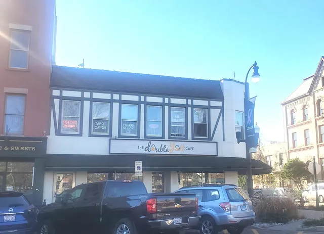 a front view of a building with parking