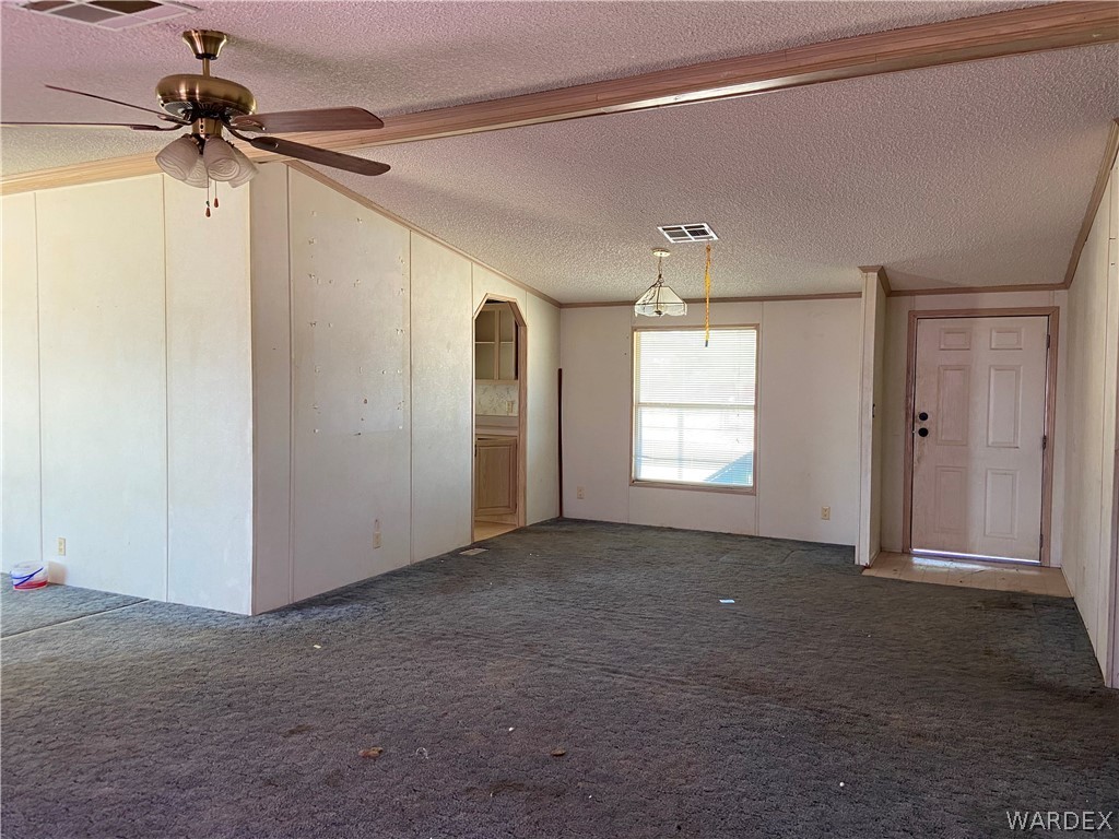 740 South Elfrida Road Golden Valley, AZ 86413 - Photo 24 of 47 a view of empty room with ceiling fan