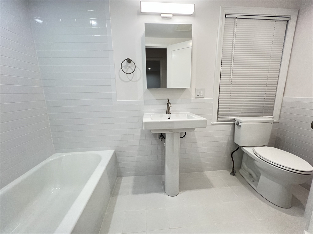 50 Conant Street, Unit 50 Danvers, MA 01923 - Photo 10 of 16 a bathroom with a sink toilet and shower