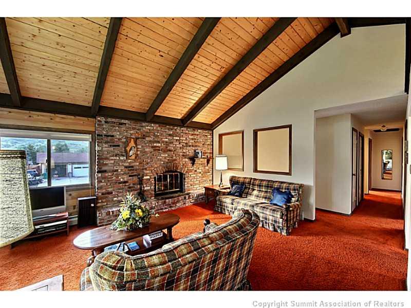 698 Deer Path Road Dillon, CO 80435 - Photo 4 of 25 a room with furniture and a fireplace