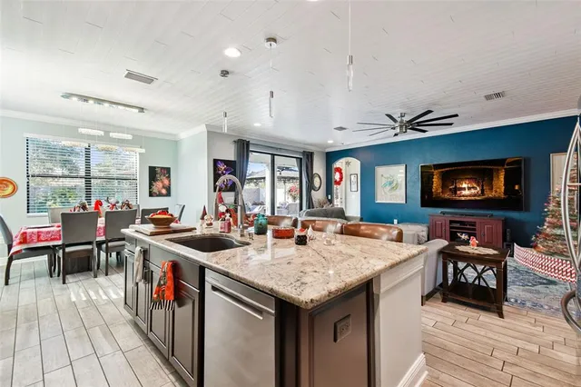 a kitchen with a stove and a dining table