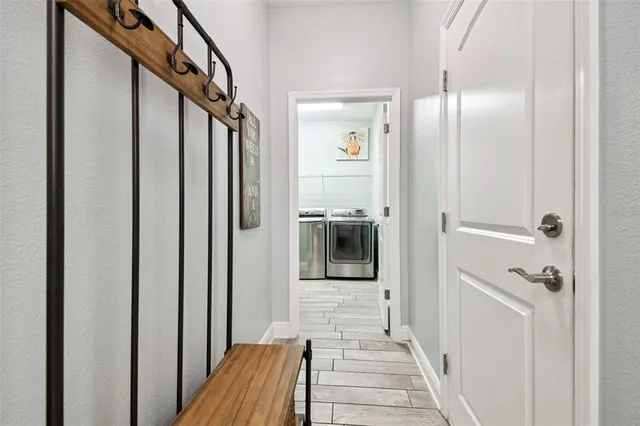 a view of storage and utility room with washer and dryer