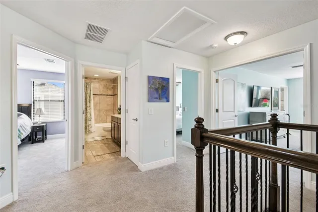 a living room with furniture and a ceiling fan