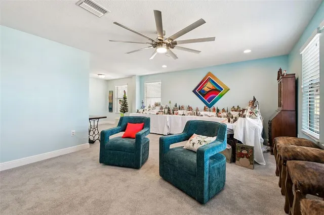 a spacious bathroom with a tub sink and mirror